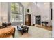 Bright living room with soaring ceilings, large windows, and neutral decor at 10330 Lions Path, Lone Tree, CO 80124