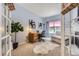 Bright office space with a desk, sofa, and natural light streaming through a window at 10330 Lions Path, Lone Tree, CO 80124