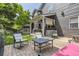 Inviting backyard patio with comfortable seating, a brick surface, and a covered outdoor lounge area at 10330 Lions Path, Lone Tree, CO 80124