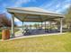 Community pavilion with picnic tables and a view of the pool, perfect for outdoor gatherings at 10330 Lions Path, Lone Tree, CO 80124