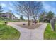 Community playground with swings, slides, and other play equipment surrounded by green grass and trees at 10330 Lions Path, Lone Tree, CO 80124