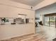View of the kitchen area with granite countertops leading into the living room at 7665 E Eastman Ave # 111A, Denver, CO 80231