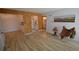 Open floor plan showcasing the kitchen, living room, and entry to the bathroom at 7665 E Eastman Ave # 111A, Denver, CO 80231