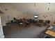 Inviting lounge area with comfortable seating, lighting fixtures and tiled floors at 7665 E Eastman Ave # 111A, Denver, CO 80231
