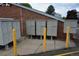 Mailboxes for the complex with yellow poles out front at 7665 E Eastman Ave # 111A, Denver, CO 80231