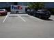 Parking lot featuring an arriving Fedex truck and numerous cars at 7665 E Eastman Ave # 111A, Denver, CO 80231