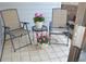 Outdoor patio featuring a table and chair seating area with tiled floor at 7665 E Eastman Ave # 111A, Denver, CO 80231