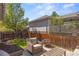 Cozy backyard area features a fire pit and outdoor seating, perfect for entertaining guests at 3529 Xanthia Ct, Denver, CO 80238