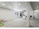 Spacious finished basement with neutral carpet, recessed lighting, and a cozy seating area at 3529 Xanthia Ct, Denver, CO 80238