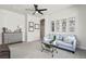 Relaxing bonus room featuring comfortable seating and decorative mirrored windows at 3529 Xanthia Ct, Denver, CO 80238