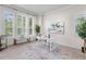 Bright home office featuring a modern desk, large windows, and stylish decor at 3529 Xanthia Ct, Denver, CO 80238