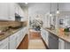 Modern kitchen featuring granite countertops, stainless steel appliances, and ample cabinet space at 3529 Xanthia Ct, Denver, CO 80238