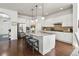 Bright, spacious kitchen with a large island and white cabinetry, perfect for gatherings at 3529 Xanthia Ct, Denver, CO 80238