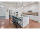 Spacious kitchen with a large island, bar stool seating, and stainless steel appliances at 3529 Xanthia Ct, Denver, CO 80238