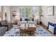 Bright living room with natural light, modern furniture, and stylish decor at 3529 Xanthia Ct, Denver, CO 80238