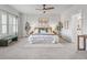 Inviting main bedroom with soft carpet, a ceiling fan, and a comfortable bed for a peaceful retreat at 3529 Xanthia Ct, Denver, CO 80238