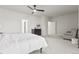 Spacious main bedroom with ceiling fan, neutral colors, and sitting area at 3529 Xanthia Ct, Denver, CO 80238