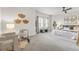 Spacious main bedroom boasts soft carpet, neutral decor, and a sitting area, creating an inviting retreat at 3529 Xanthia Ct, Denver, CO 80238