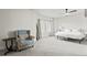Airy main bedroom with a sitting area, neutral colors, and a ceiling fan at 3529 Xanthia Ct, Denver, CO 80238