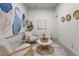 Cozy sitting room features modern furnishings, artwork, and plenty of natural light at 3529 Xanthia Ct, Denver, CO 80238