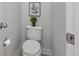 Cozy half bathroom features modern fixtures, neutral walls, and decorative wall art at 3529 Xanthia Ct, Denver, CO 80238