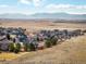 An aerial view of a neighborhood with mountain views at 4939 Silver Feather Cir, Broomfield, CO 80023