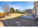 Large backyard featuring a patio and a rustic wooden fence at 4939 Silver Feather Cir, Broomfield, CO 80023