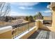 Balcony offering panoramic views of the landscape, blue sky, and distant mountains at 4939 Silver Feather Cir, Broomfield, CO 80023