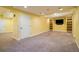 Versatile basement space with recessed lighting, open layout, and built-in shelving at 4939 Silver Feather Cir, Broomfield, CO 80023