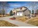 Attractive two-story home featuring a two-car garage, stylish stone accents, and well-maintained landscaping at 4939 Silver Feather Cir, Broomfield, CO 80023