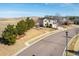 Traditional two-story home with landscaped front yard and mature trees at 4939 Silver Feather Cir, Broomfield, CO 80023