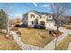 Charming two-story home with a well-manicured lawn, appealing stone accents, and a convenient two-car garage at 4939 Silver Feather Cir, Broomfield, CO 80023