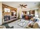 Inviting living room showcasing a stone fireplace, open layout, and comfortable seating for relaxation at 4939 Silver Feather Cir, Broomfield, CO 80023