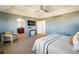 Relaxing main bedroom showcasing neutral tones, a ceiling fan, and plush carpet flooring at 4939 Silver Feather Cir, Broomfield, CO 80023