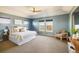 Spacious main bedroom with tray ceiling, natural light, and soothing color palette at 4939 Silver Feather Cir, Broomfield, CO 80023