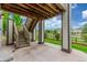 Outdoor patio area with view of stairs and backyard lawn at 676 Fossil Bed Cir, Erie, CO 80516