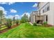 Fenced backyard with lawn and manicured garden beds at 676 Fossil Bed Cir, Erie, CO 80516