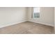 Bright bedroom featuring neutral walls, plush carpeting, and a sunlit window at 676 Fossil Bed Cir, Erie, CO 80516