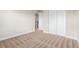 Neutral bedroom with closet and doorway to a staircase at 676 Fossil Bed Cir, Erie, CO 80516