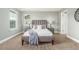 The primary bedroom features carpet and a gray upholstered bed frame at 676 Fossil Bed Cir, Erie, CO 80516