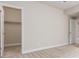 Bedroom featuring neutral walls and trim, and doorway to a closet at 676 Fossil Bed Cir, Erie, CO 80516