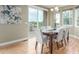 Bright dining room featuring hardwood floors and sliding glass doors to a deck at 676 Fossil Bed Cir, Erie, CO 80516