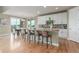 The eat-in kitchen has a granite countertop island with room for seating at 676 Fossil Bed Cir, Erie, CO 80516