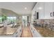 Modern kitchen with granite countertops and stainless appliances overlooking dining room at 676 Fossil Bed Cir, Erie, CO 80516