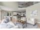 Open-concept living area with a view of the kitchen and dining space at 676 Fossil Bed Cir, Erie, CO 80516