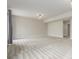 Large living room featuring neutral walls, plush carpeting, and modern lighting at 676 Fossil Bed Cir, Erie, CO 80516