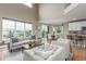 Open-concept living area with a view of the kitchen and dining space at 676 Fossil Bed Cir, Erie, CO 80516