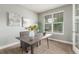Bright office space with a large window, neutral colors, and a stylish desk at 676 Fossil Bed Cir, Erie, CO 80516