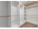 This walk-in closet features custom shelving at 676 Fossil Bed Cir, Erie, CO 80516