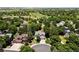 Expansive aerial view of a neighborhood near a golf course, showcasing mature trees and diverse home styles at 1473 E 130Th Dr, Thornton, CO 80241